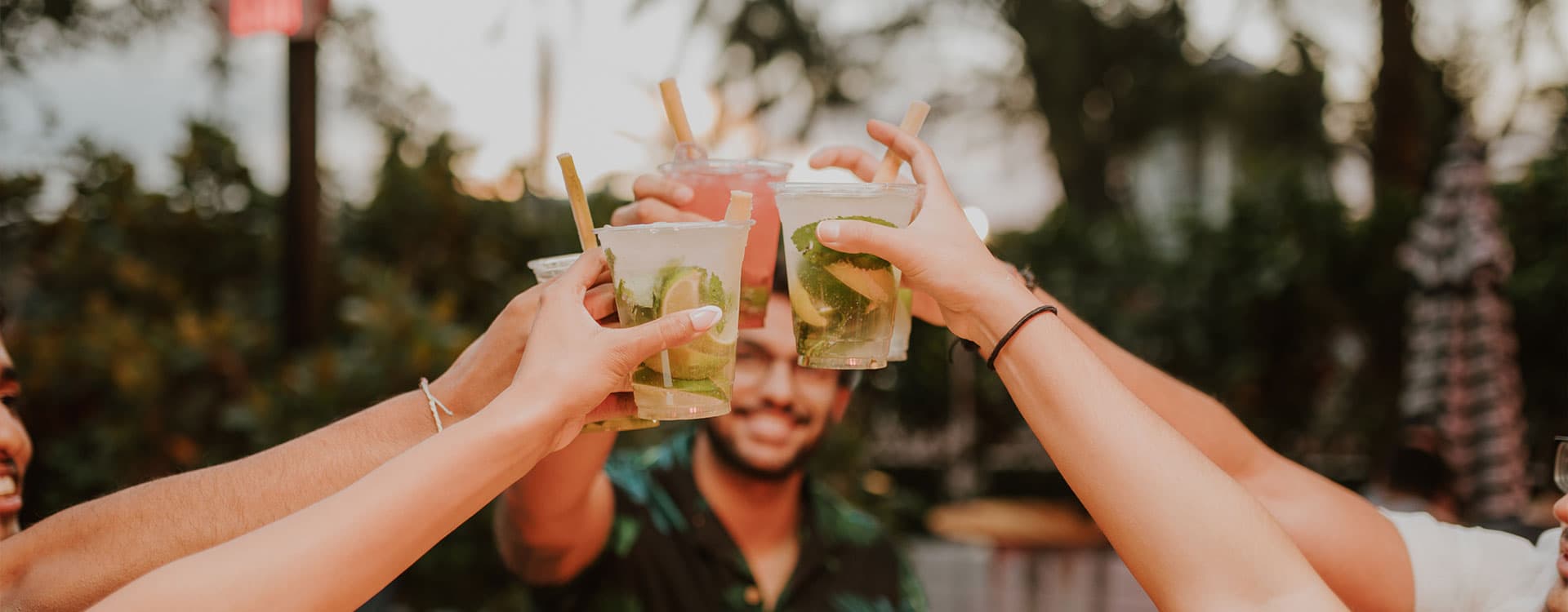 Friends toasting cocktails at The Wharf Fort Lauderdale waterfront venue