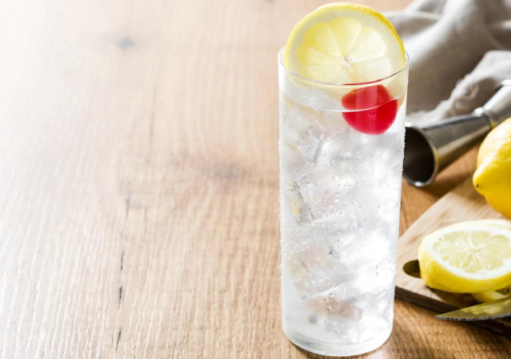 Tom Collins cocktail on wooden table